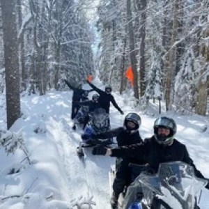 a group of people that are standing in the snow