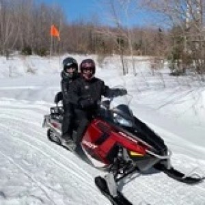 a man riding a motorcycle in the snow