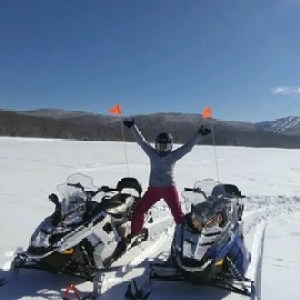 a man sitting on a snowmobile