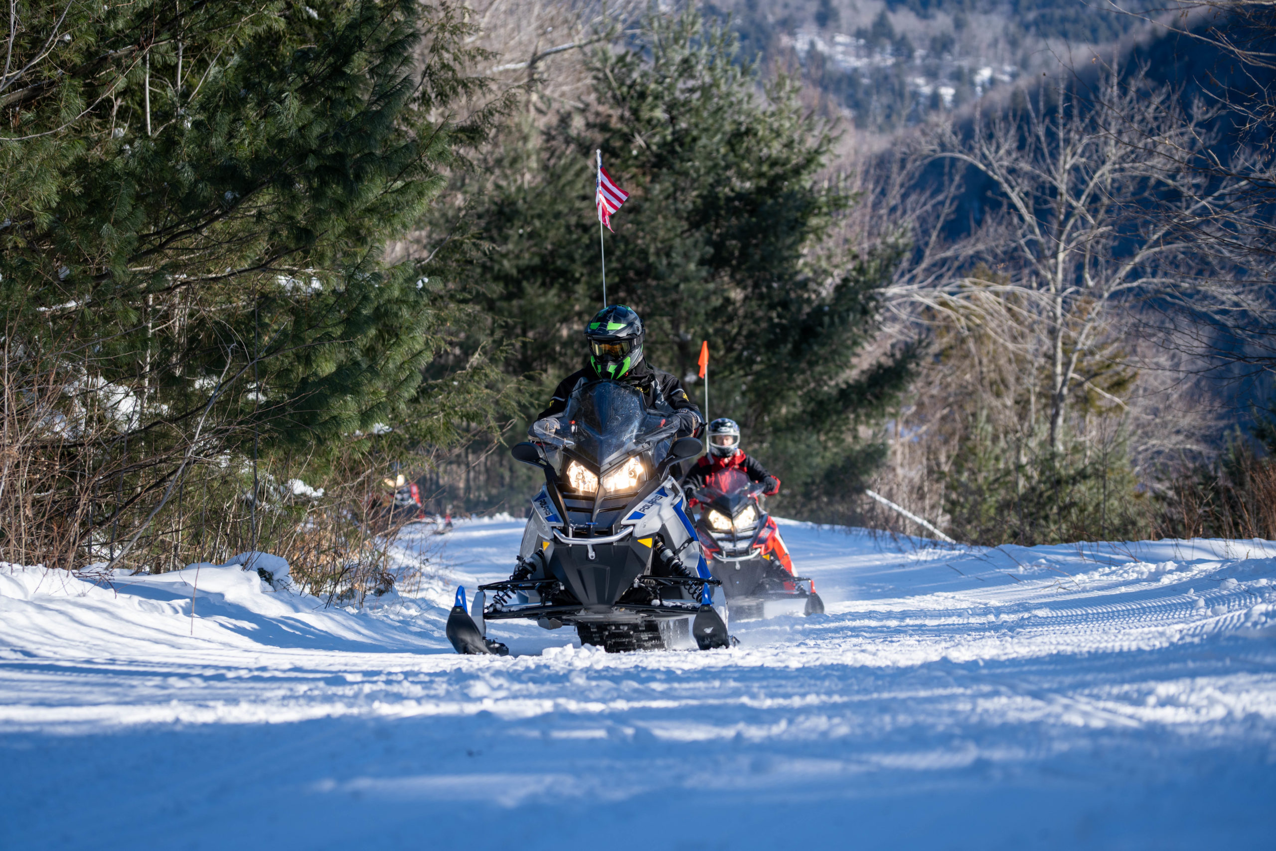 snowmobile vermotn guide leads a tour at the killington location of the best snowmobile tours in the east